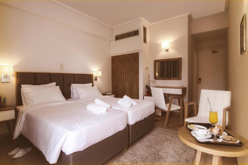 Postel nebo postele na pokoji v ubytování Green Hill Hotel