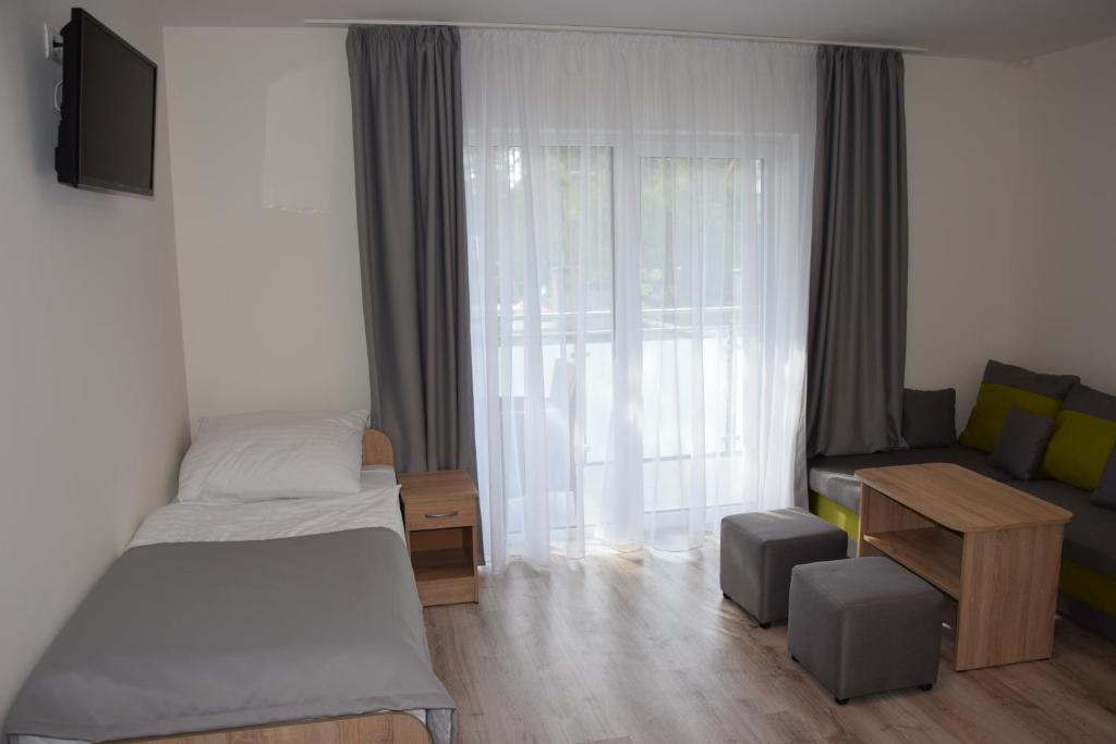 Postel nebo postele na pokoji v ubytování Dom Gościnny Matex