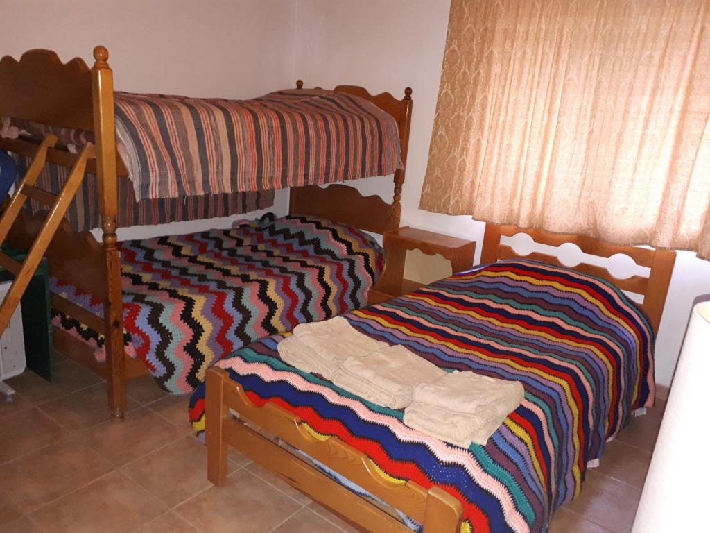 Postel nebo postele na pokoji v ubytování Agrompelo House