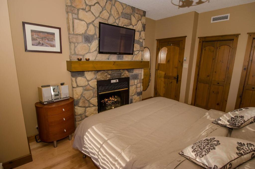 Postel nebo postele na pokoji v ubytování Luxurious Equinoxe Ski-in/Ski-out
