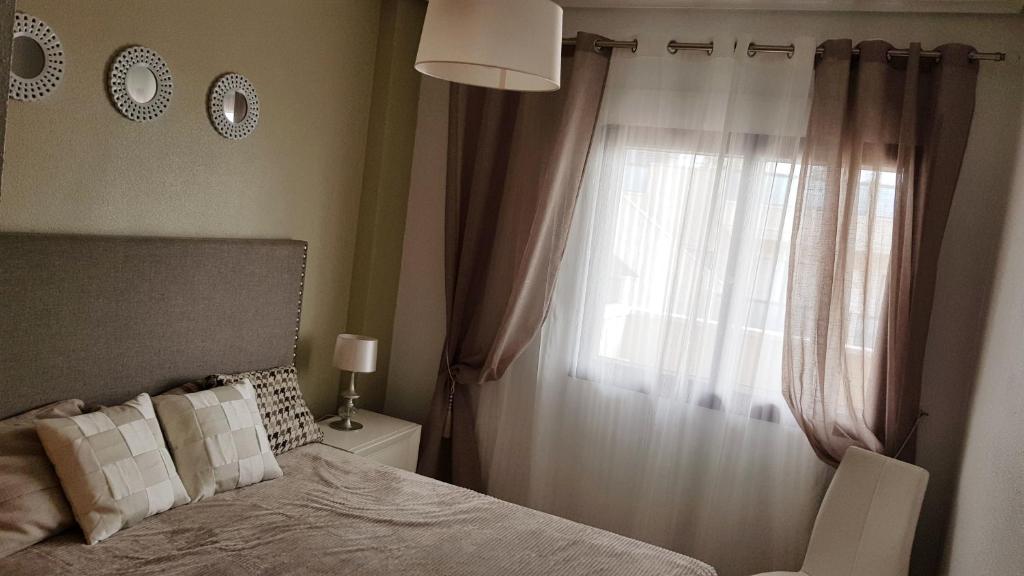 Postel nebo postele na pokoji v ubytování Orihuela Costa Costamarina Cabo Roig Apartamentos TIKASA