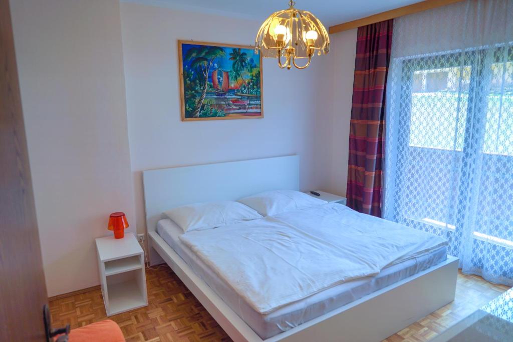 Postel nebo postele na pokoji v ubytování Gasthof Podobnik