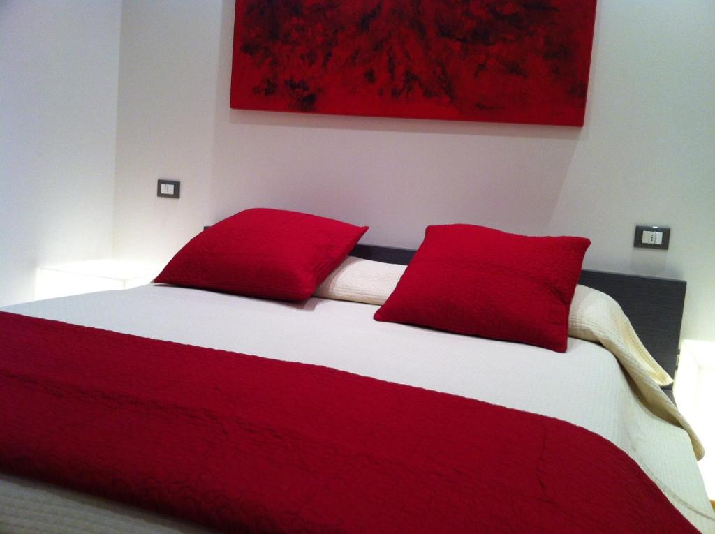 Łóżko lub łóżka w pokoju w obiekcie Romeo Design Rooms