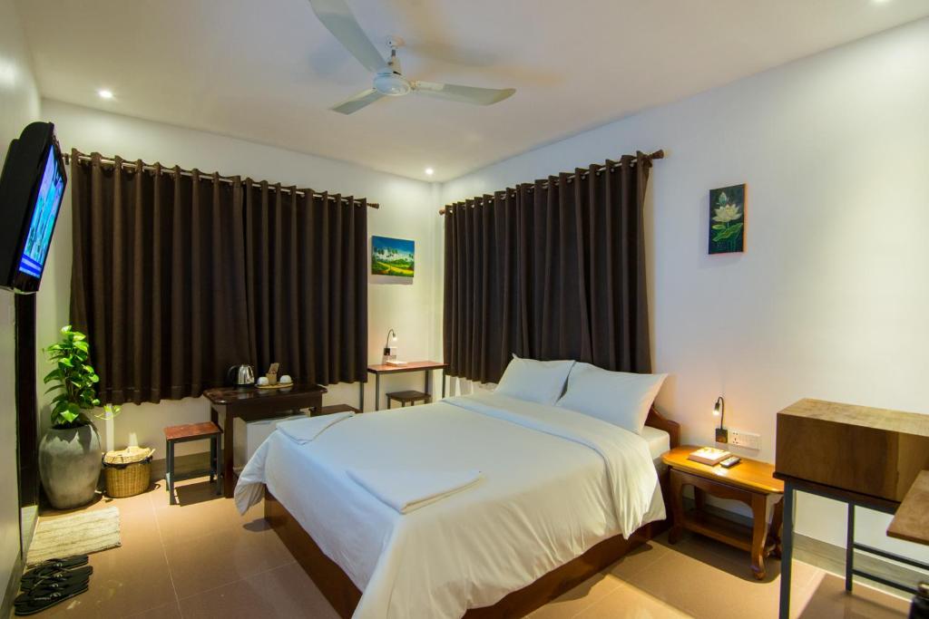 Postel nebo postele na pokoji v ubytování Bokre Angkor Hostel