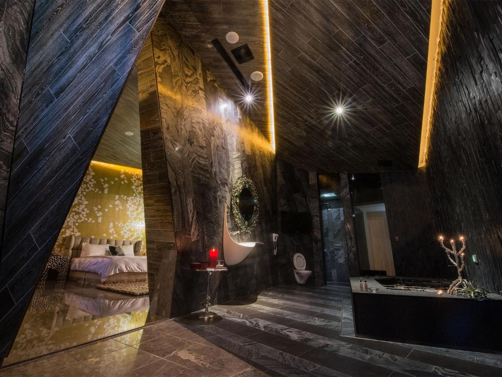 Postel nebo postele na pokoji v ubytování Shuei Wu Villa