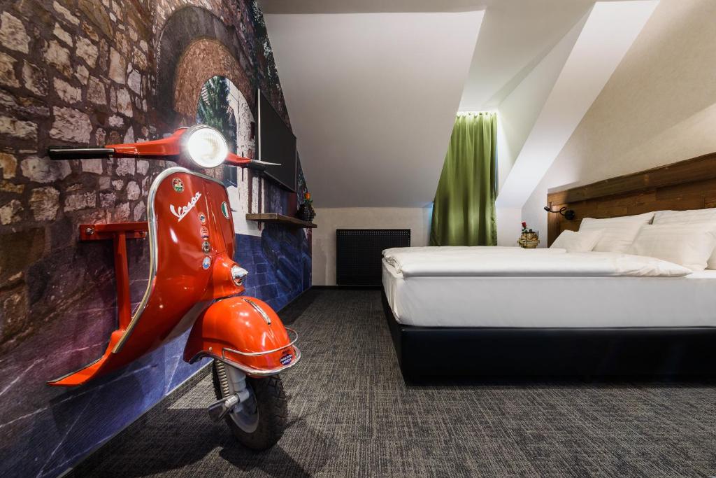 Postel nebo postele na pokoji v ubytování RQ Boutique & Unique Hotel