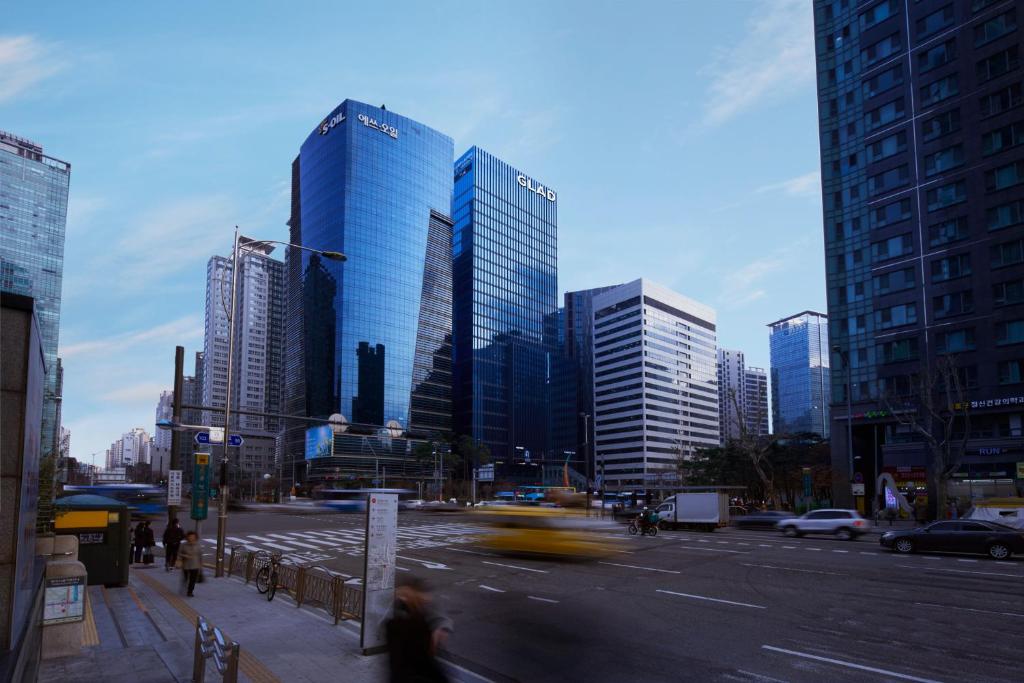 a city with tall buildings and cars on a street at GLAD Mapo in Seoul