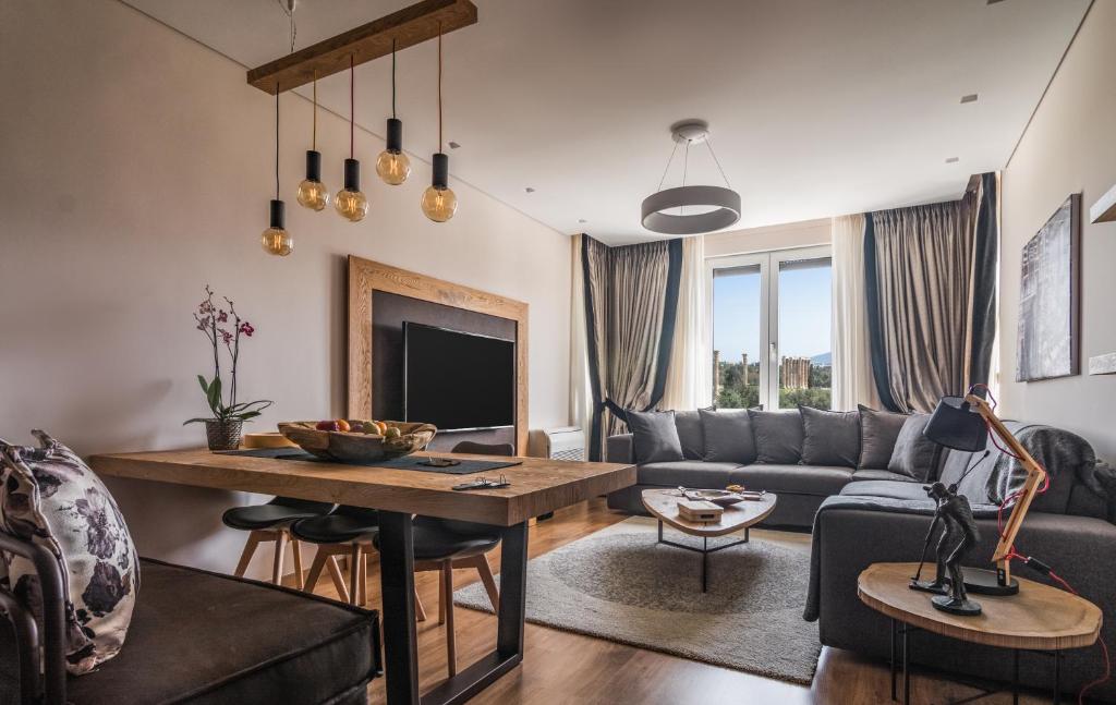 a living room with a couch and a table at Acropolis Exclusive Residences in Athens