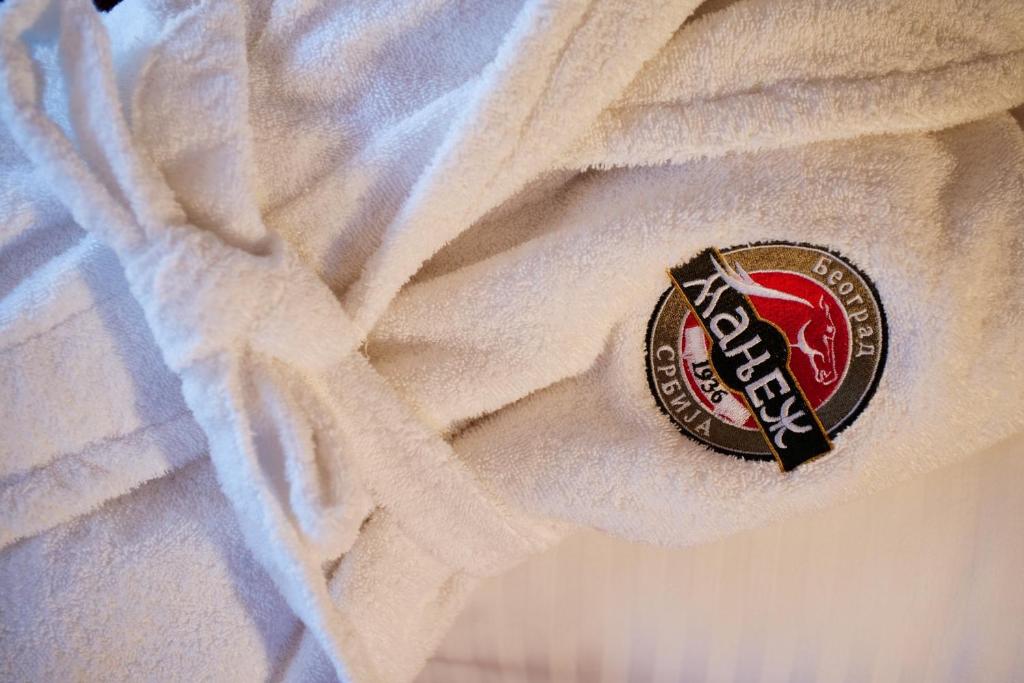 a close up of a label on a white shirt at Manjež Centar in Belgrade