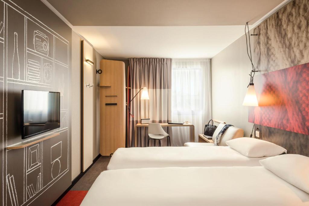 Postel nebo postele na pokoji v ubytování ibis Baden Neuenhof