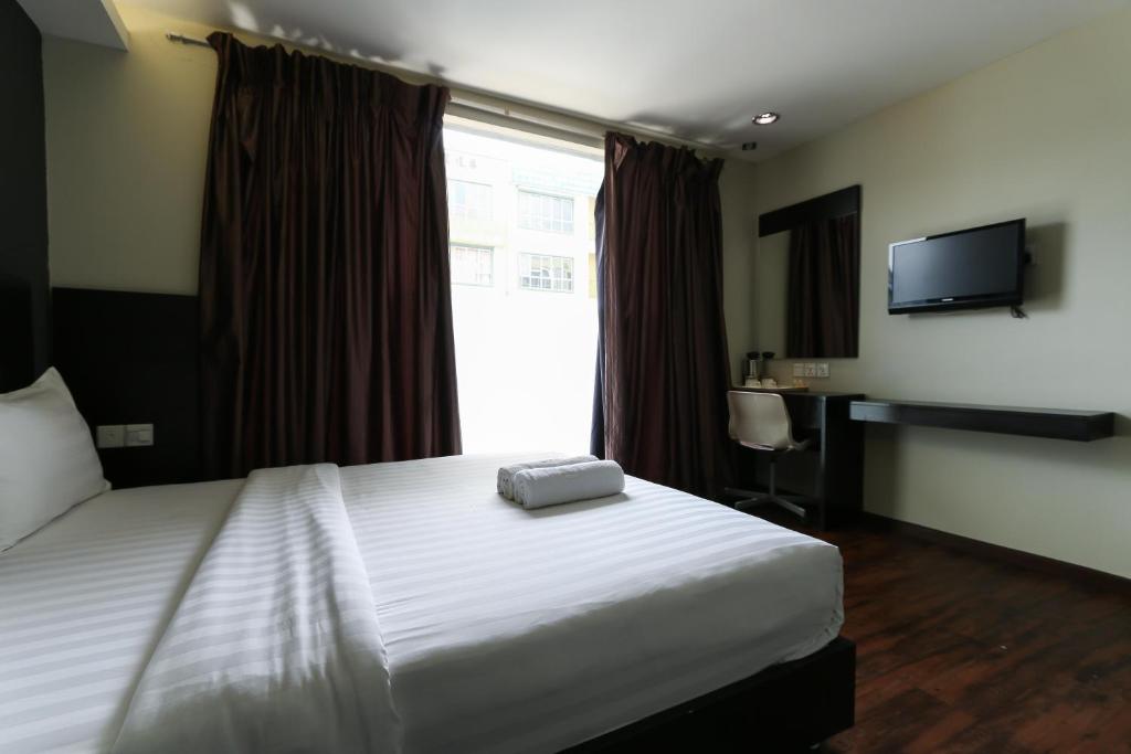 Postel nebo postele na pokoji v ubytování Hotel 99 Bandar Klang (Meru)