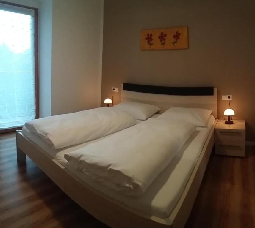 Postel nebo postele na pokoji v ubytování Gletscherblick