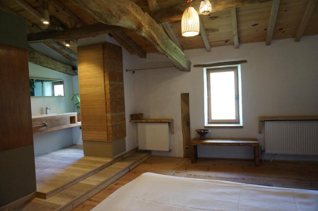 Postel nebo postele na pokoji v ubytování Au garcin