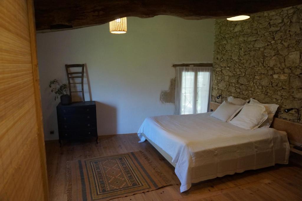 Postel nebo postele na pokoji v ubytování Au garcin