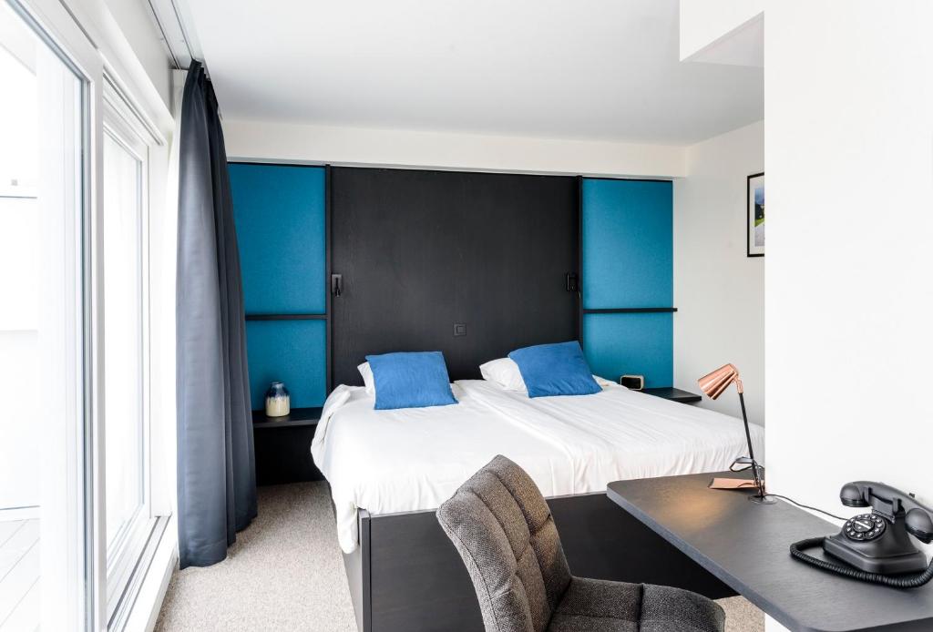 Postel nebo postele na pokoji v ubytování Hotel Nelson