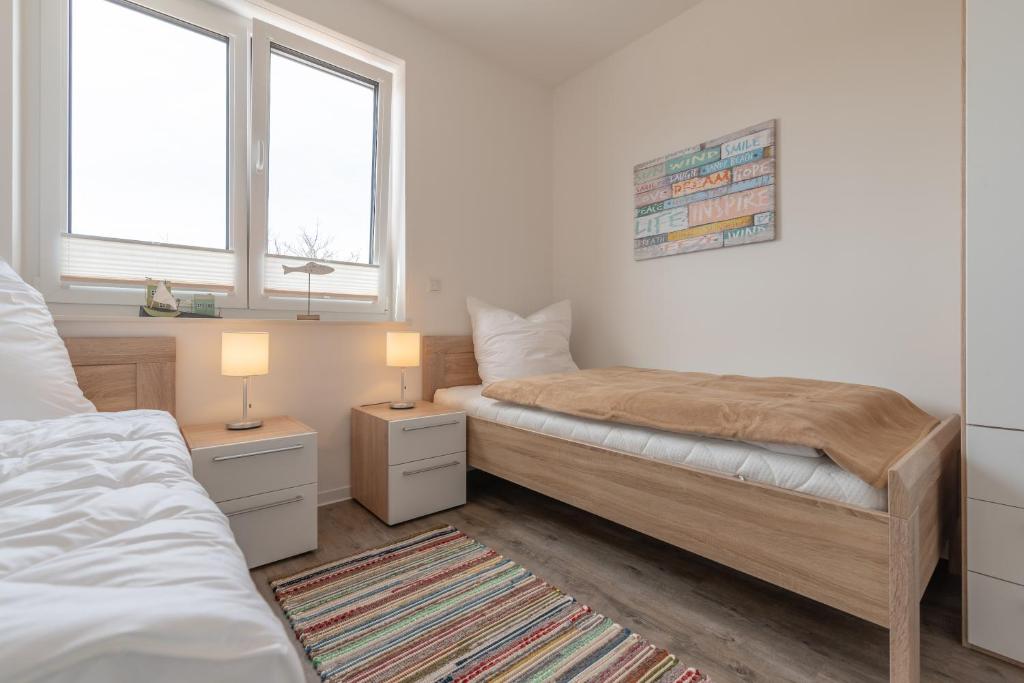 Postel nebo postele na pokoji v ubytování Haus Baltic Cube