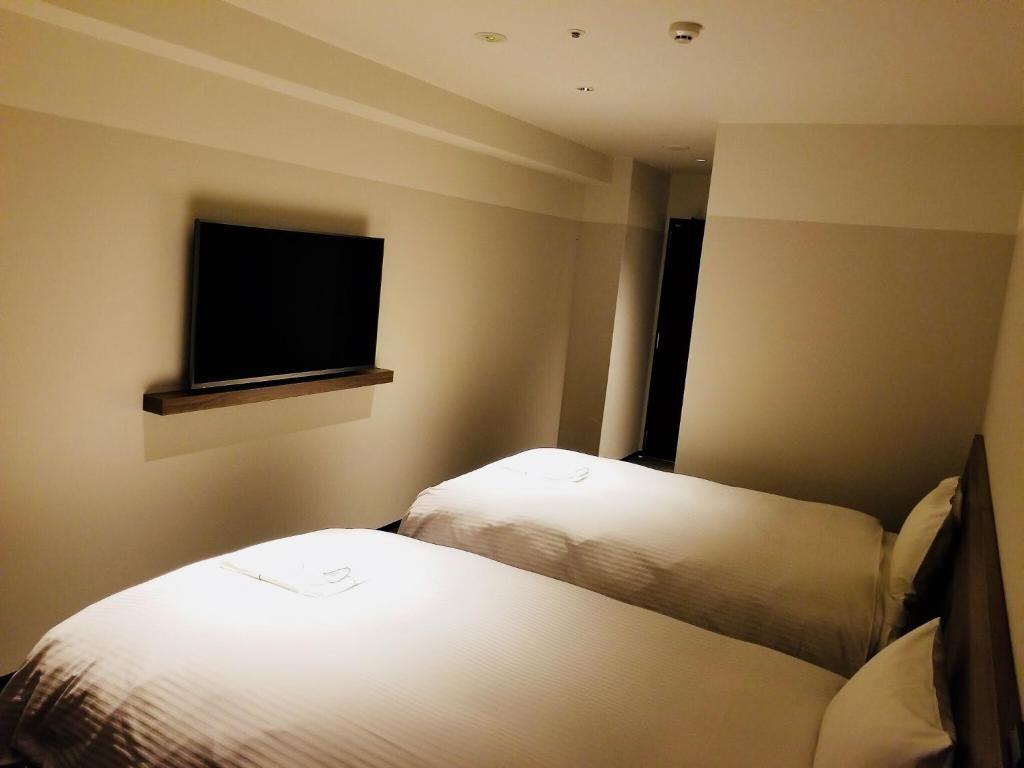 Postel nebo postele na pokoji v ubytování BRENZA HOTEL