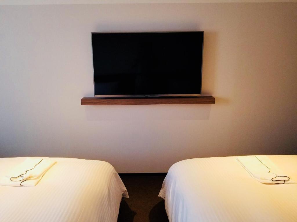 Postel nebo postele na pokoji v ubytování BRENZA HOTEL
