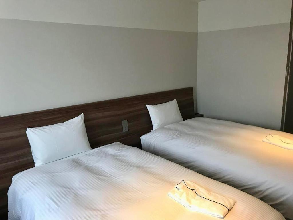 Postel nebo postele na pokoji v ubytování BRENZA HOTEL