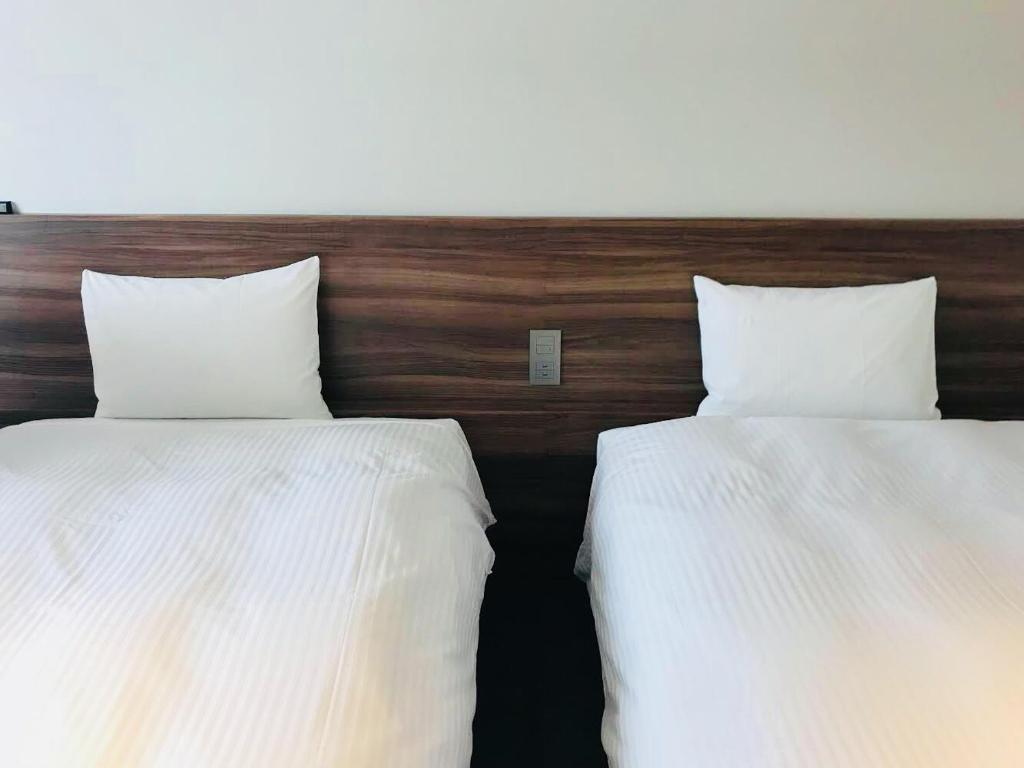 Postel nebo postele na pokoji v ubytování BRENZA HOTEL