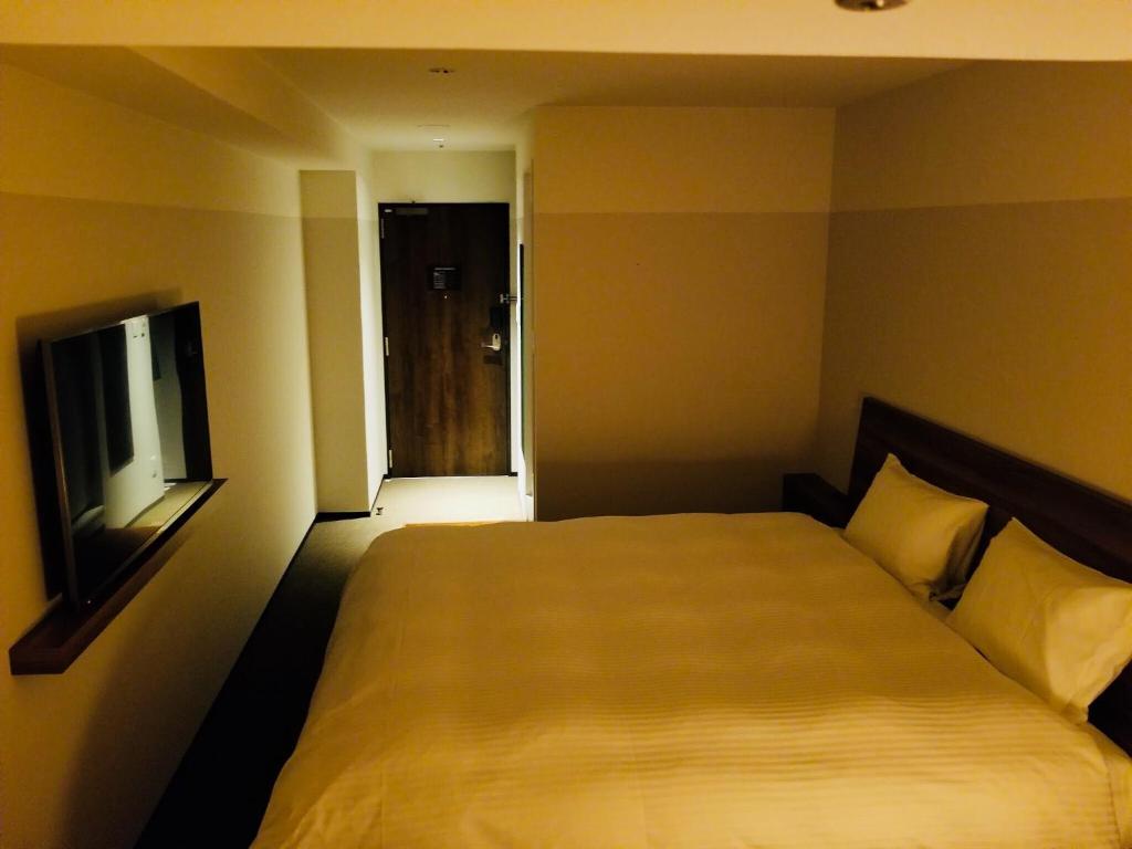 Postel nebo postele na pokoji v ubytování BRENZA HOTEL