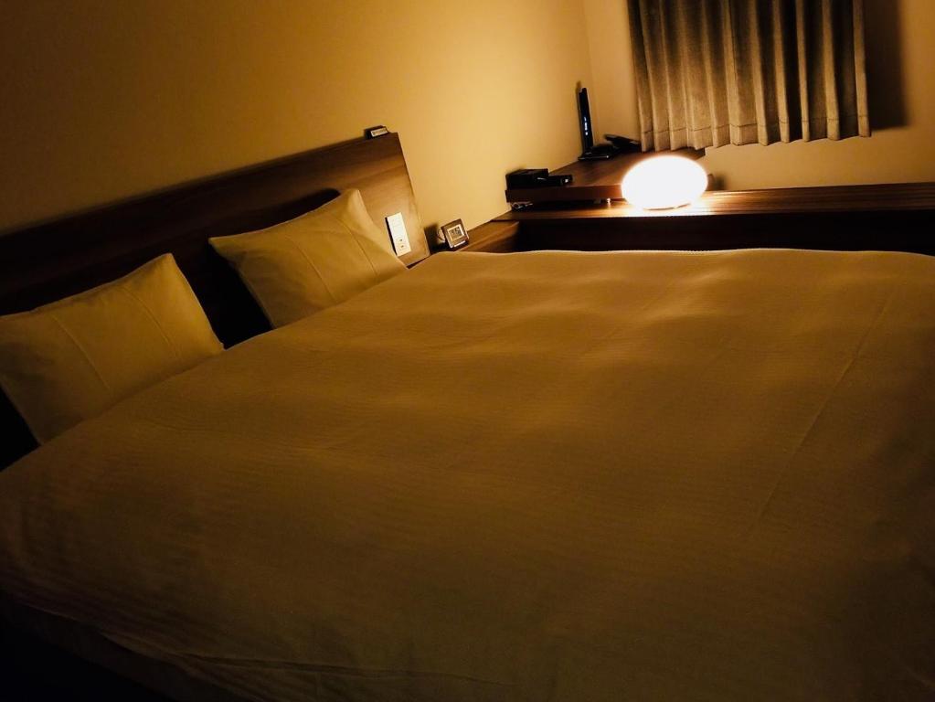Postel nebo postele na pokoji v ubytování BRENZA HOTEL