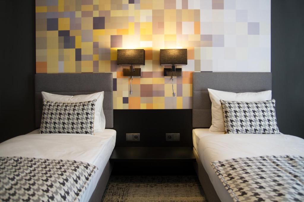 Postel nebo postele na pokoji v ubytování IBB Hotel Gdańsk