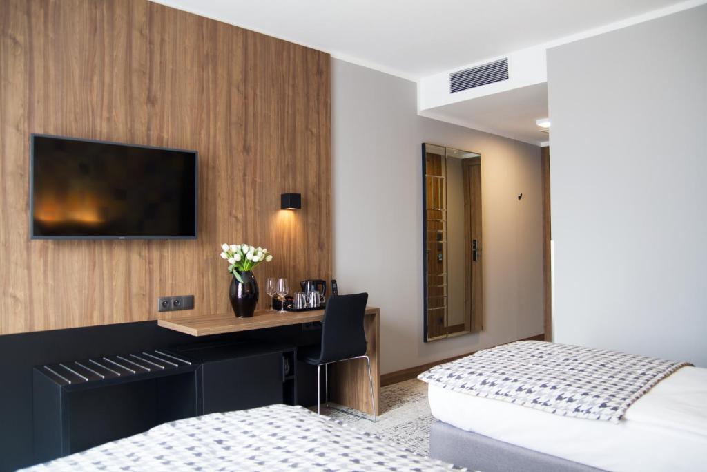 Postel nebo postele na pokoji v ubytování IBB Hotel Gdańsk