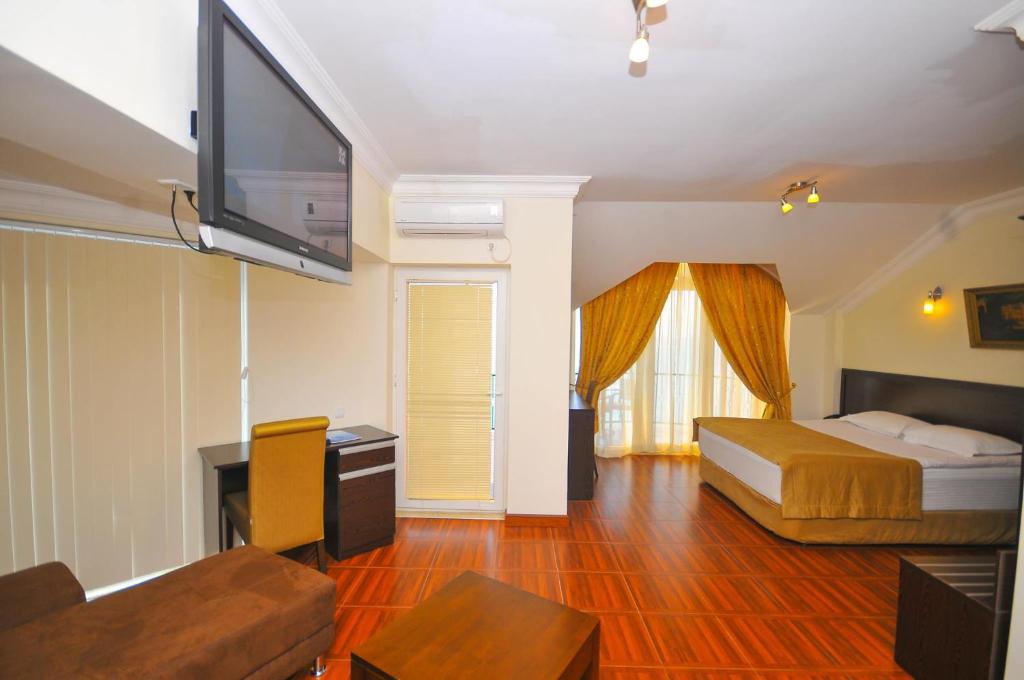 Postel nebo postele na pokoji v ubytování Hotel Neptun Kvariati