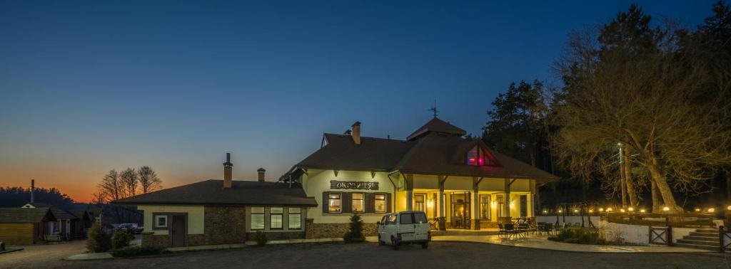 a white truck parked in front of a building at Inn Okolitsya in Protsev