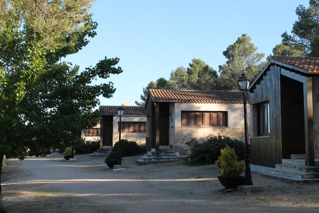 a home in the woods with a driveway at Casas Rurales el Cerrete de Haro in Fuentelespino de Haro