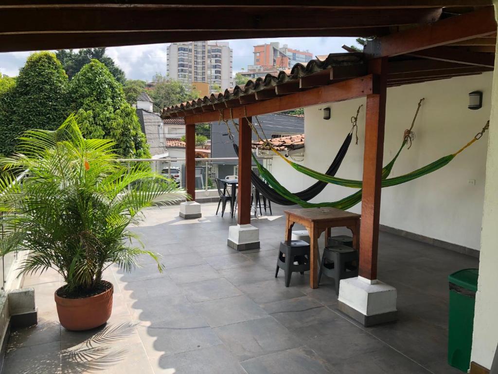 a patio area with a patio table and chairs at Black Sheep Medellin in Medellín