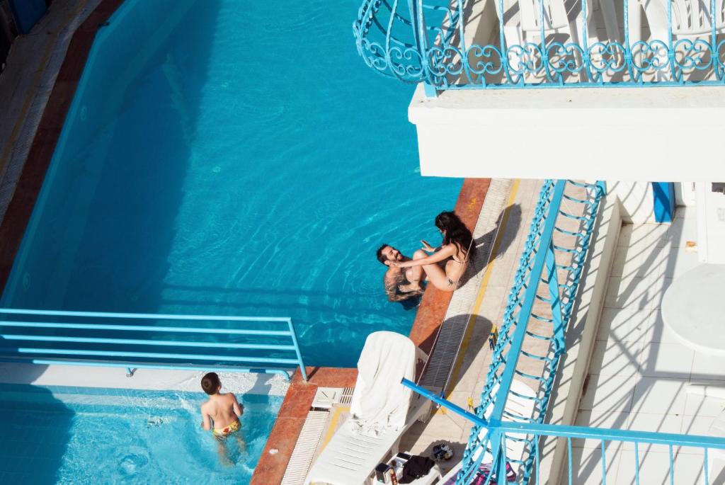 a group of people in a swimming pool on a cruise ship at Marigold Otel in Çeşme