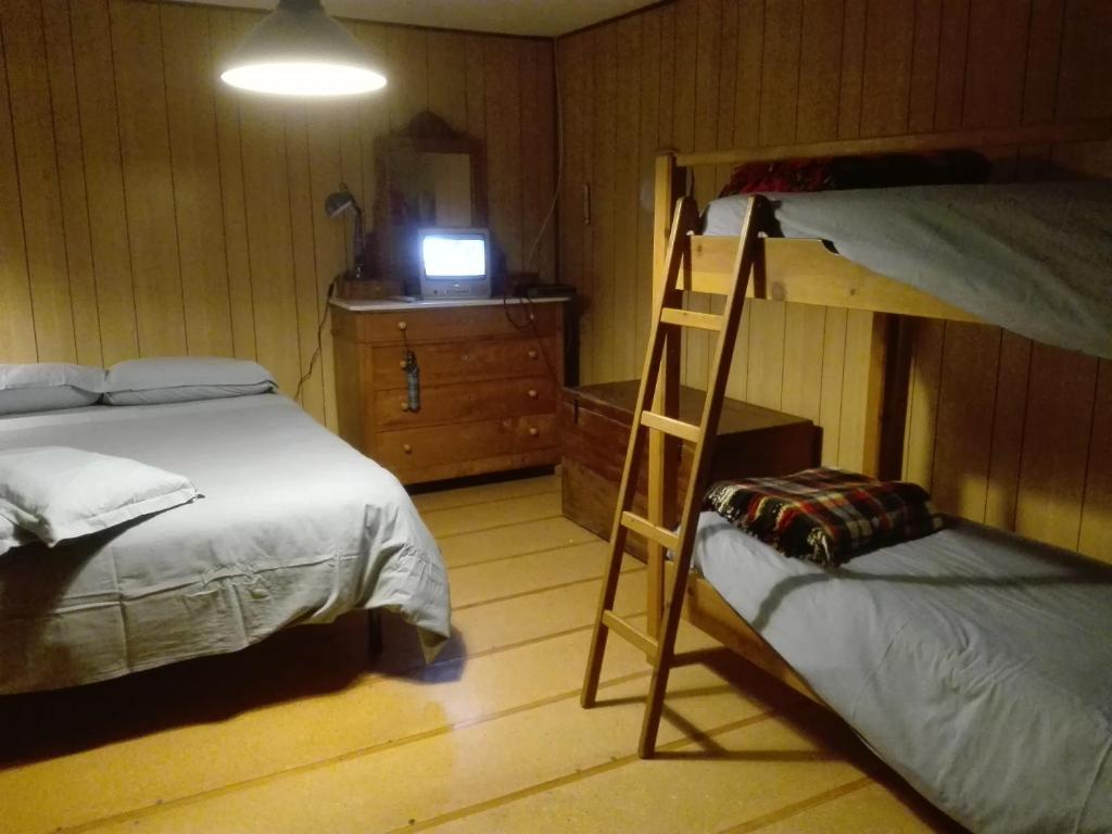 Postel nebo postele na pokoji v ubytování Baita nonno Guido