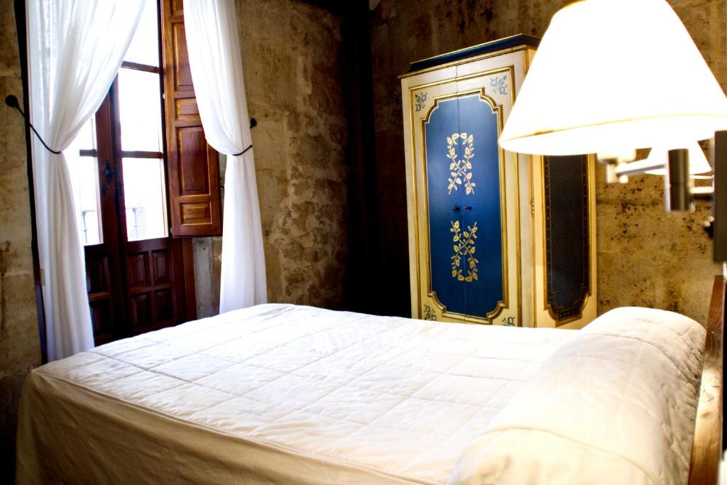 Postel nebo postele na pokoji v ubytování Hotel Microtel Placentinos