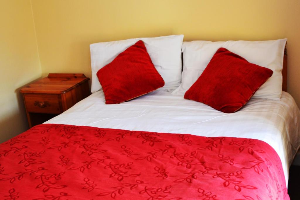 A bed or beds in a room at Church View Guest House