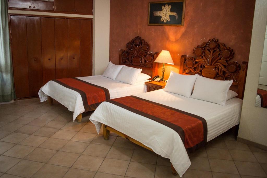 Postel nebo postele na pokoji v ubytování Hotel Real Azteca Boulevard