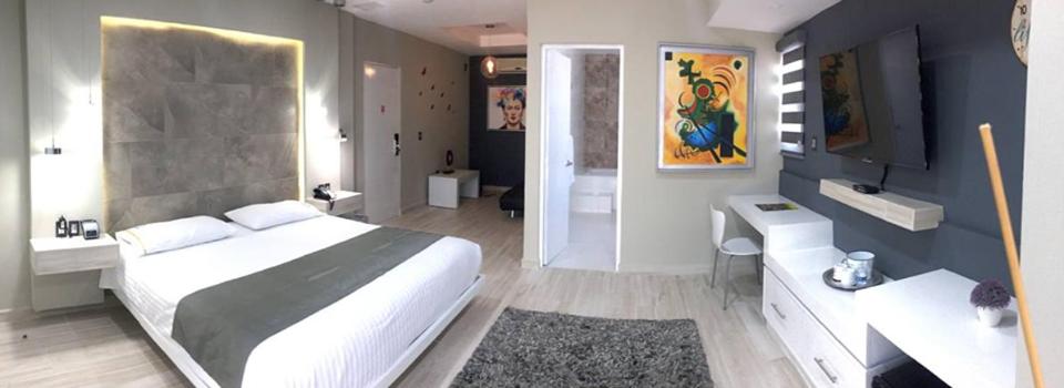 Postel nebo postele na pokoji v ubytování Hotel Real Azteca Boulevard
