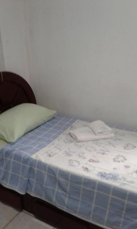 Postel nebo postele na pokoji v ubytování Hospedagem Progresso