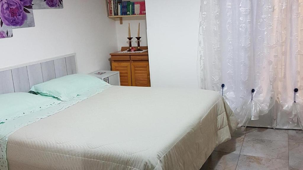 Łóżko lub łóżka w pokoju w obiekcie B&B Regina Elena
