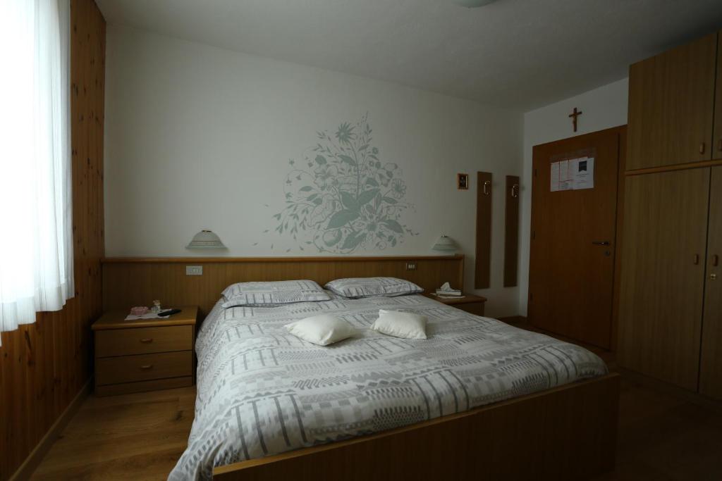Postel nebo postele na pokoji v ubytování Garni Miravalle