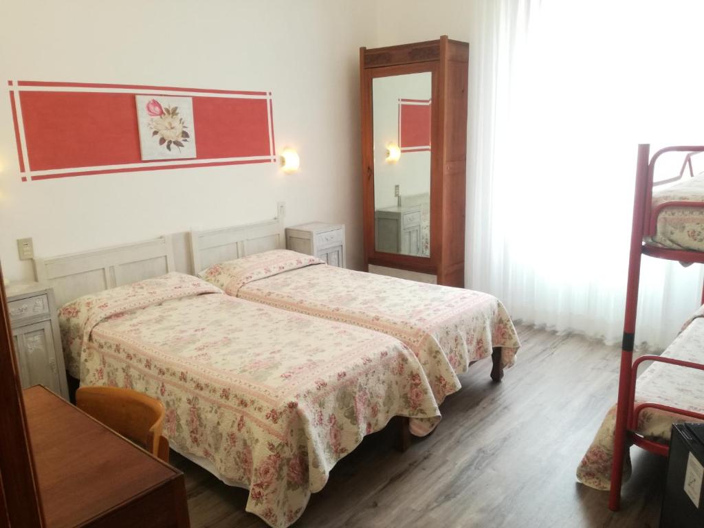Postel nebo postele na pokoji v ubytování Hotel Prati