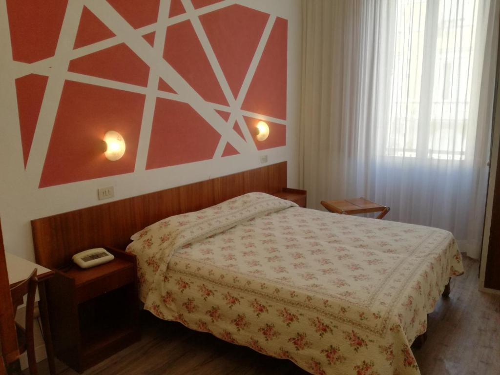 Postel nebo postele na pokoji v ubytování Hotel Prati