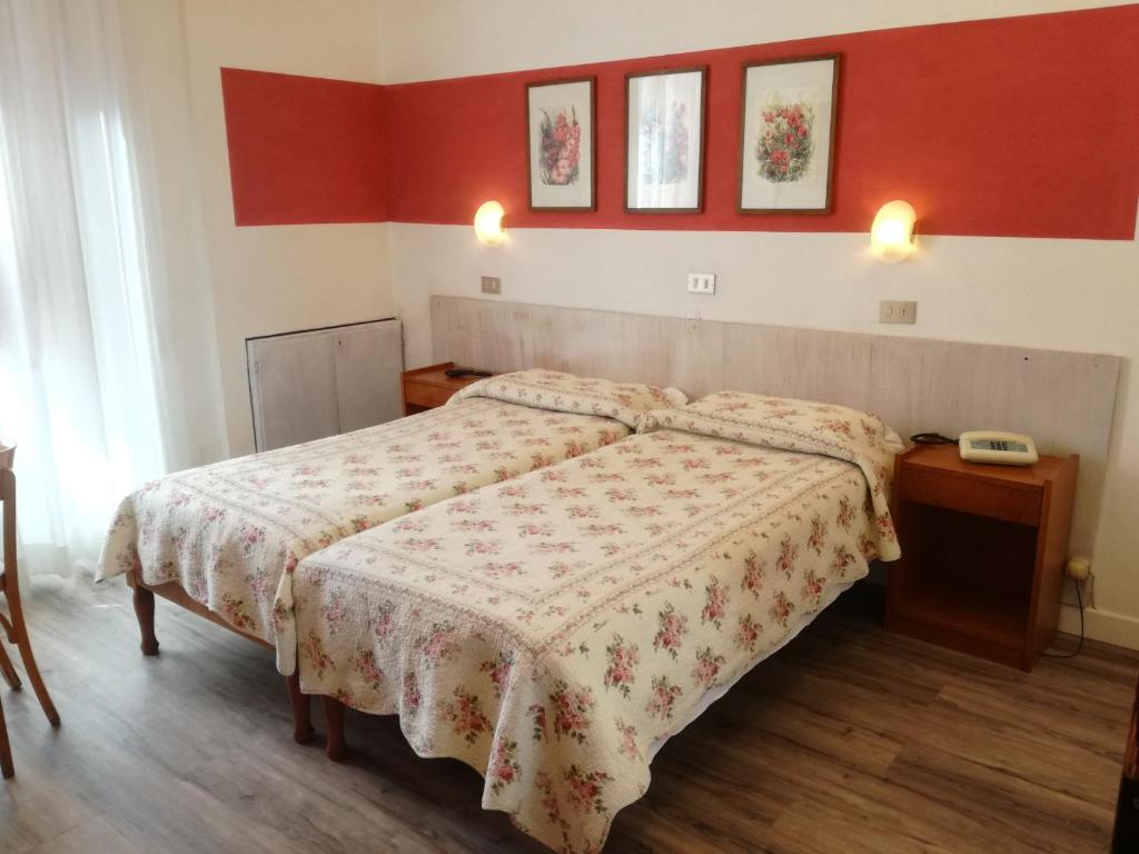 Postel nebo postele na pokoji v ubytování Hotel Prati