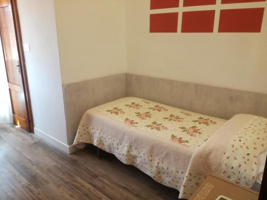 Postel nebo postele na pokoji v ubytování Hotel Prati