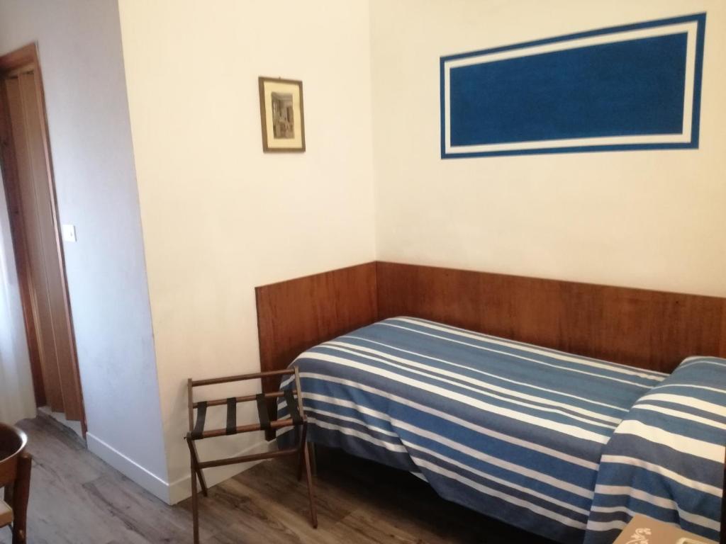 Postel nebo postele na pokoji v ubytování Hotel Prati