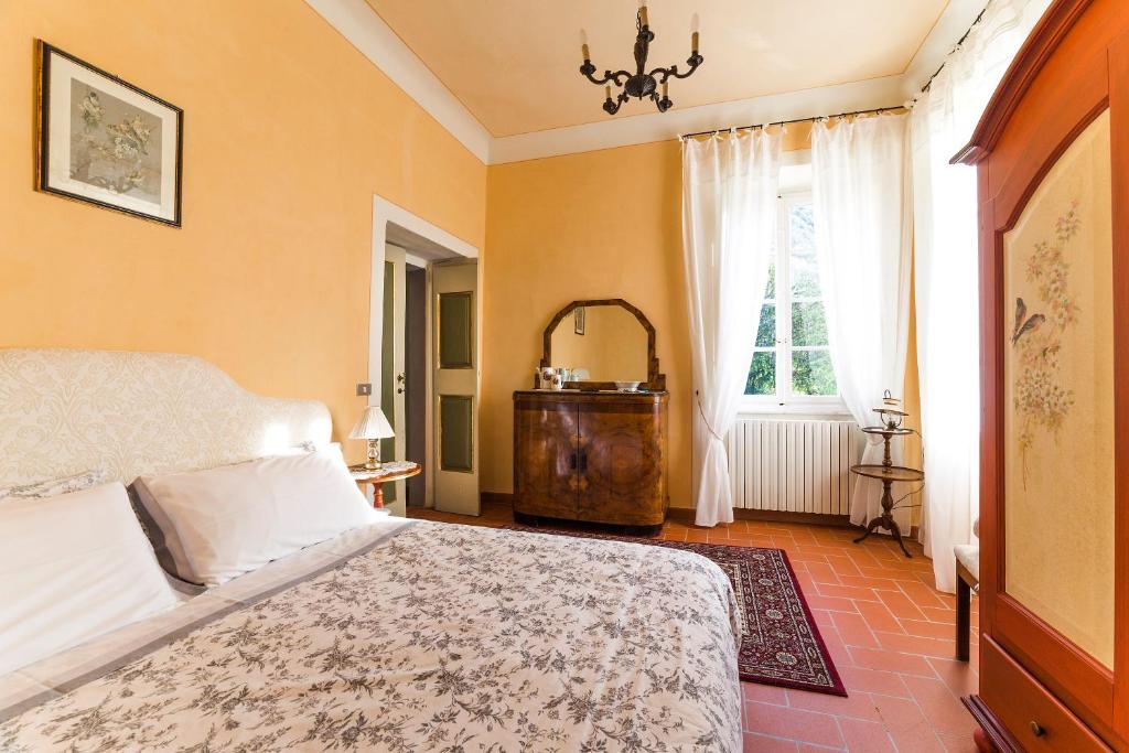Postel nebo postele na pokoji v ubytování Villa Orsolini