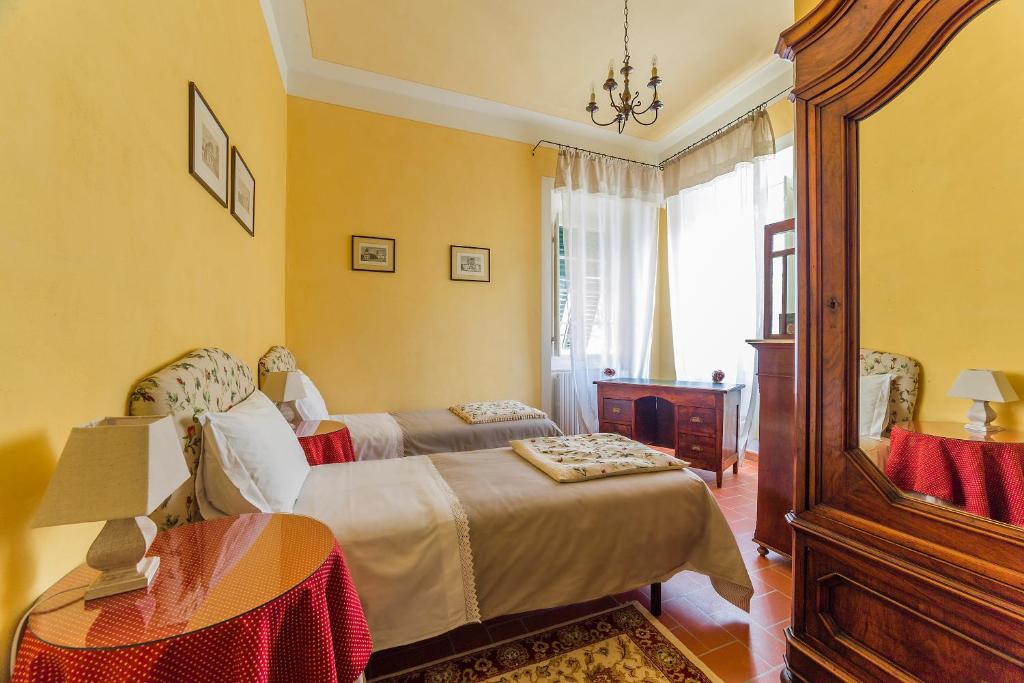 Postel nebo postele na pokoji v ubytování Villa Orsolini
