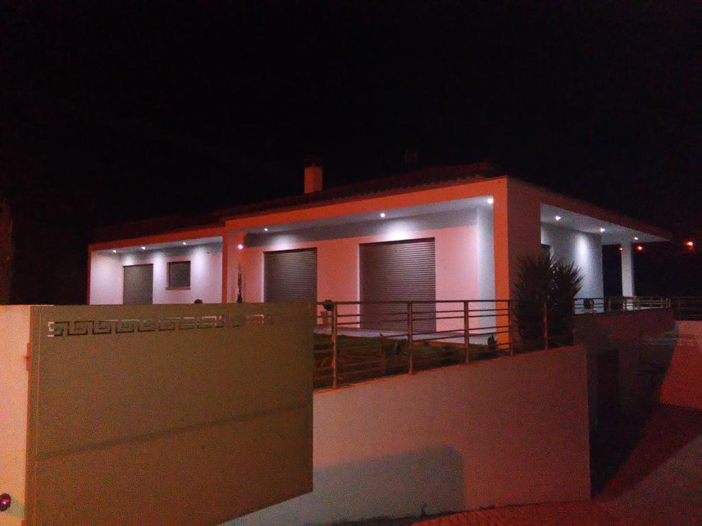 a house with lights on it at night at Casa Francisco in Batalha