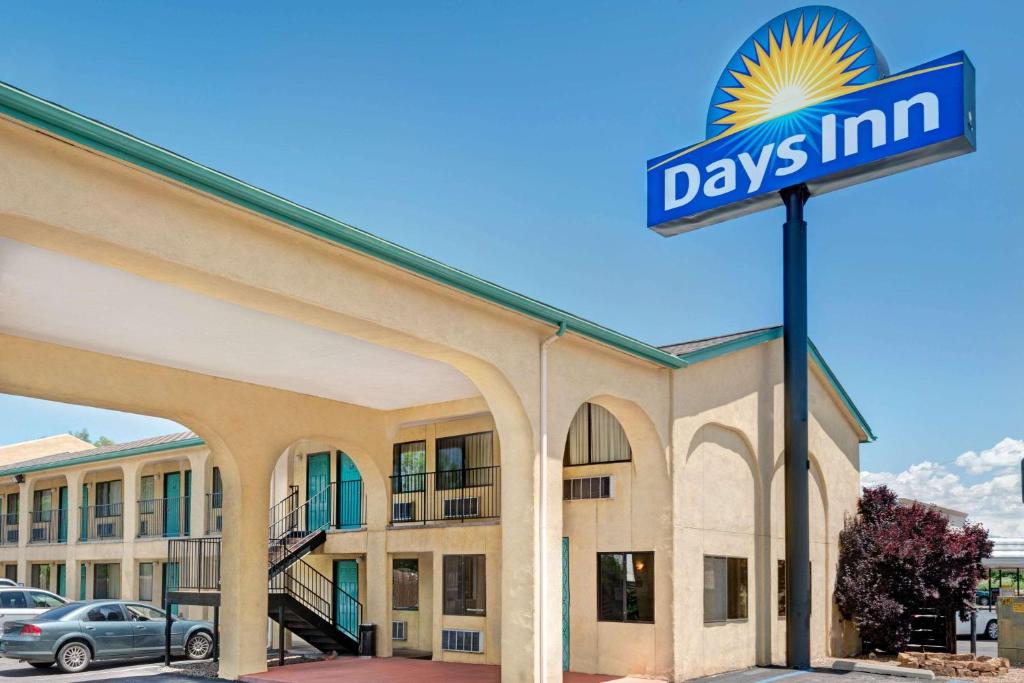 a days inn sign in front of a building at Days Inn by Wyndham Espanola in Espanola